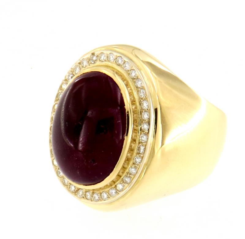 Anello in oro giallo 750\1000 con pietra  prugna e contorno di diamantini mis.14